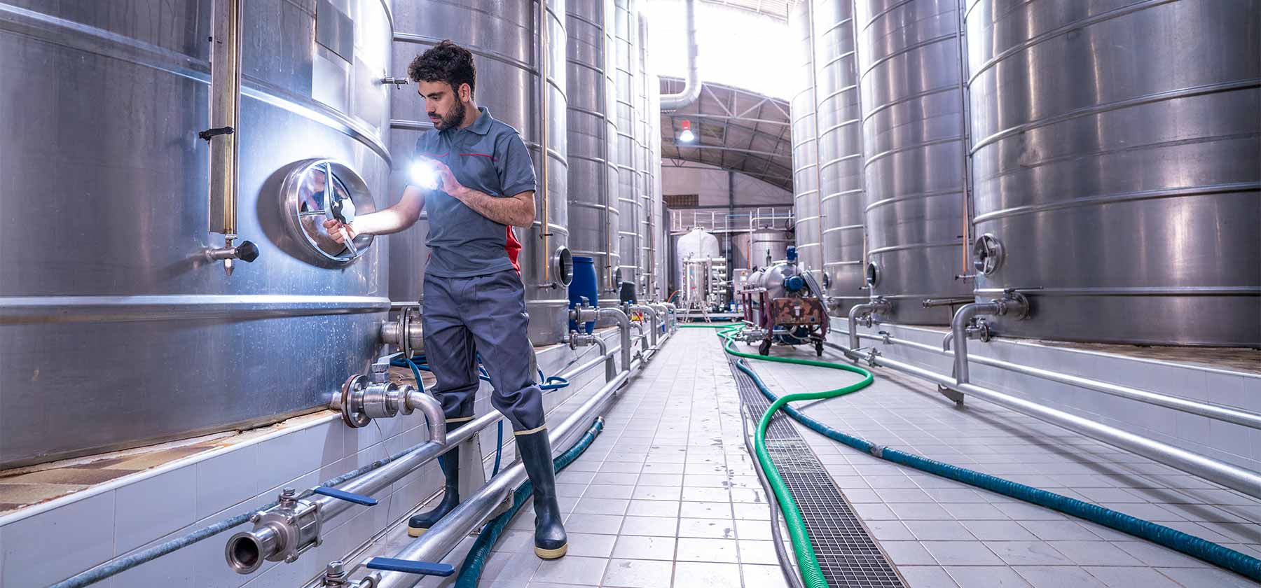 A technician inspects a tank